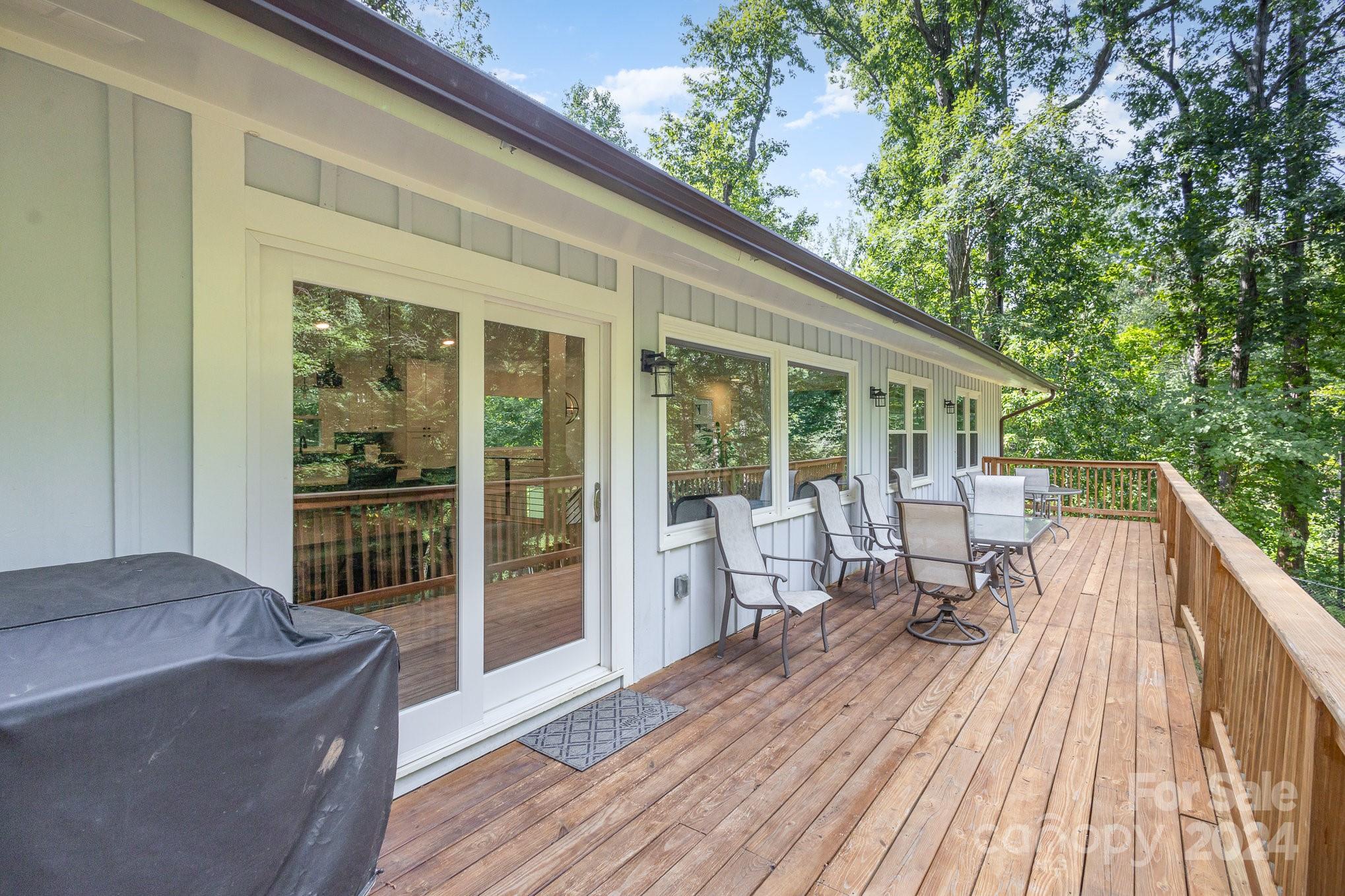 10625 East Lake Road Charlotte, NC 28215 - Photo 38 of 44 a balcony with wooden floor and furniture