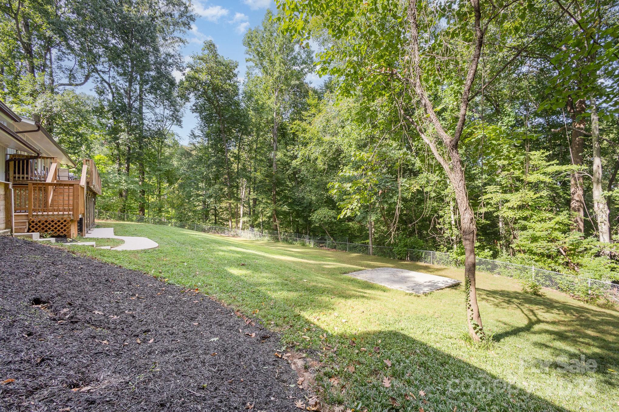 10625 East Lake Road Charlotte, NC 28215 - Photo 40 of 44 a view of a yard with of tree