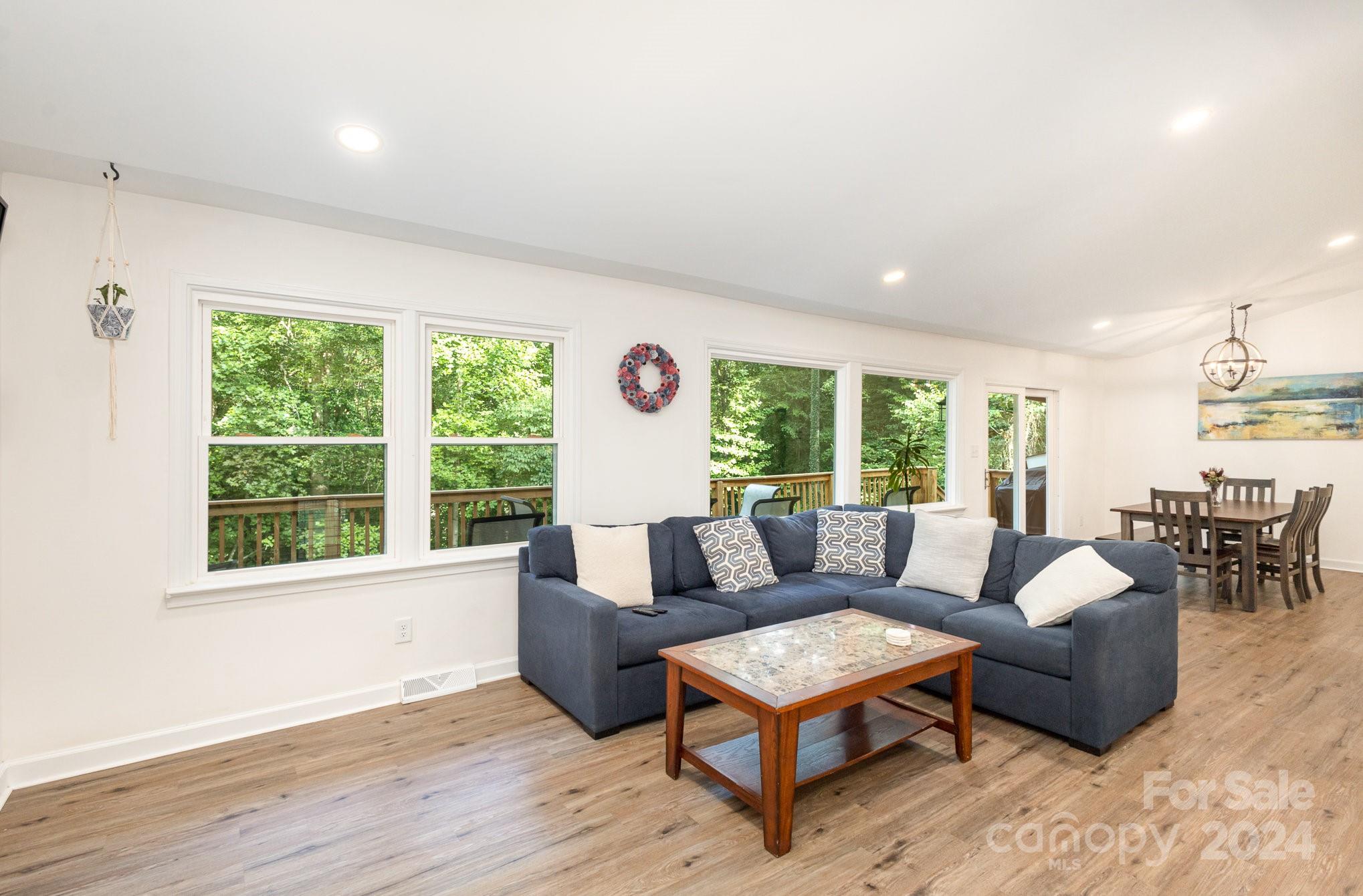 10625 East Lake Road Charlotte, NC 28215 - Photo 4 of 44 a living room with furniture and a large window