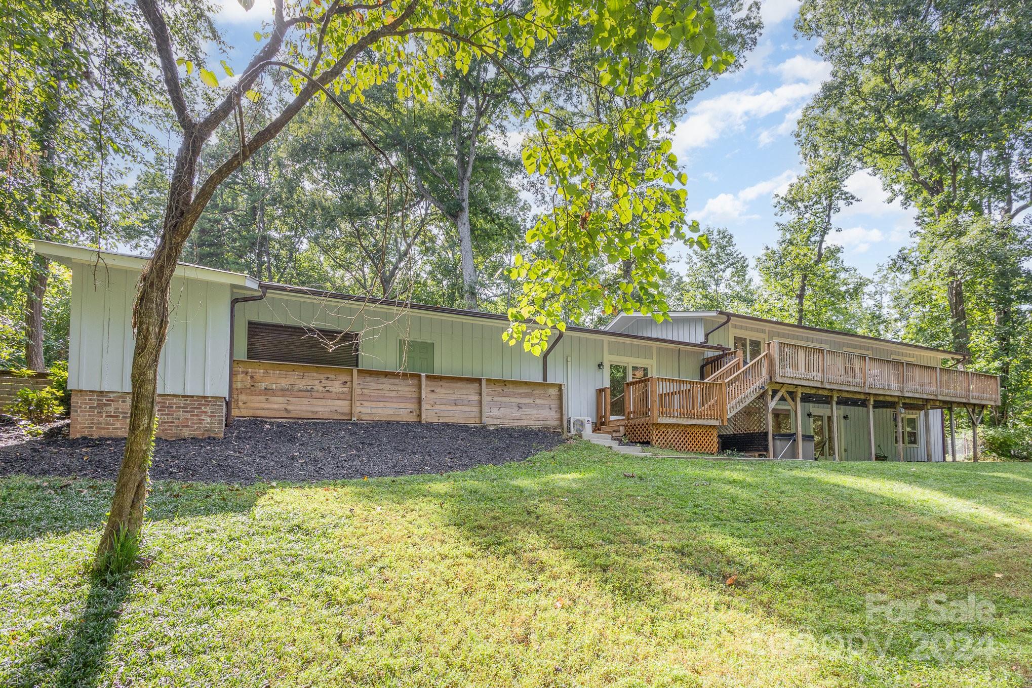 10625 East Lake Road Charlotte, NC 28215 - Photo 41 of 44 a view of a house with a yard and sitting area