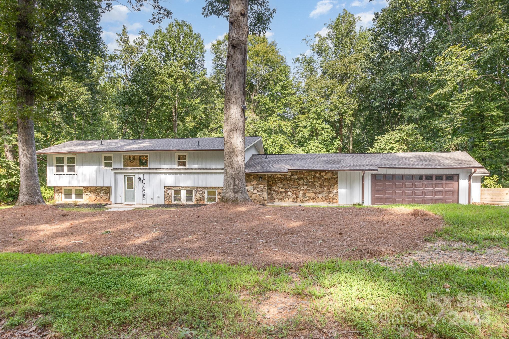 10625 East Lake Road Charlotte, NC 28215 - Photo 42 of 44 front view of a house with a yard