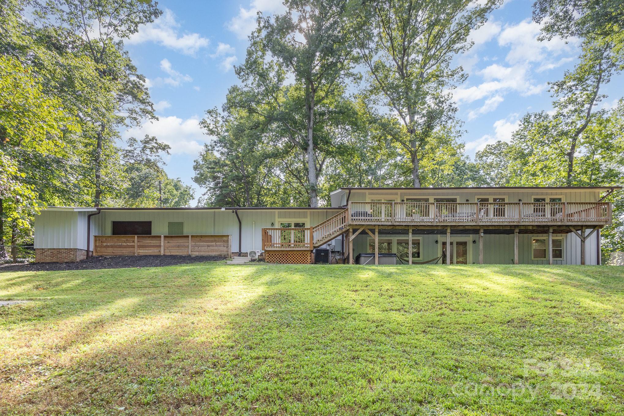 10625 East Lake Road Charlotte, NC 28215 - Photo 43 of 44 a view of a house with a yard and sitting area