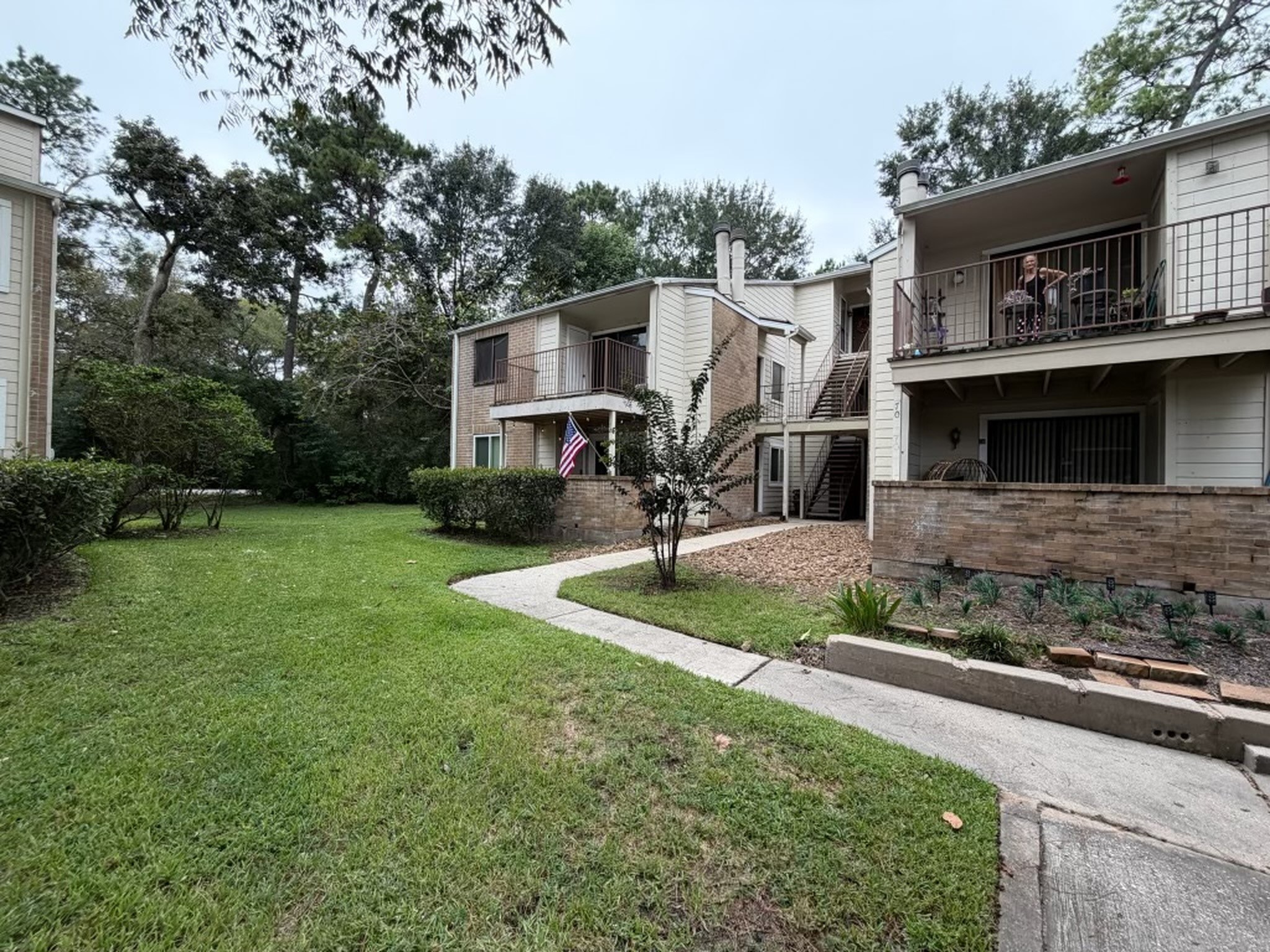 3500 Tangle Brush Drive, Unit 65 Spring, TX 77381 - Photo 2 of 20 Desirable first-floor corner unit offering added privacy and easy, stair-free access, surrounded by mature trees and well-maintained green space.