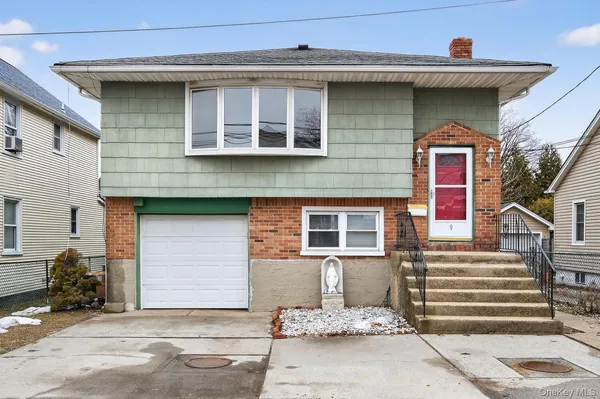 a front view of a house with a garage