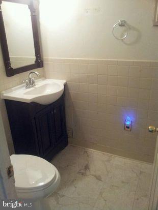 825 Templecliff Road Pikesville, MD 21208 - Photo 7 of 8 Half bath on main level