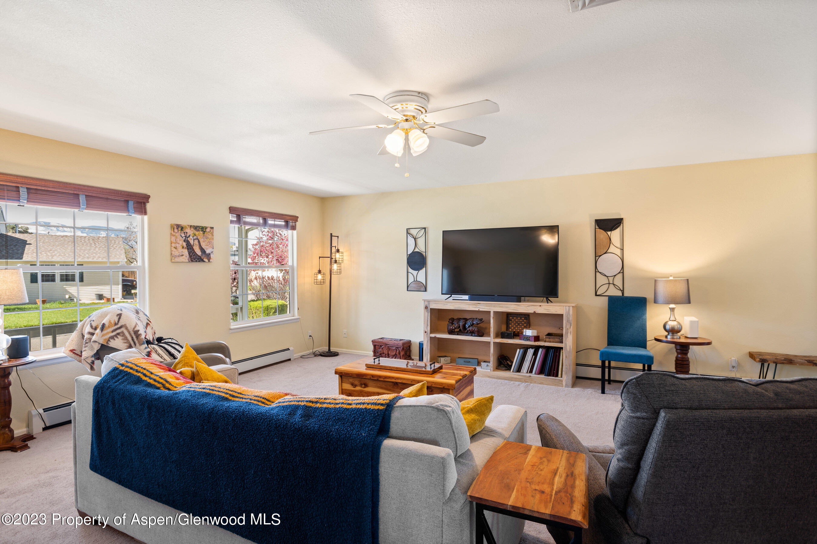 506 Columbine Drive Rifle, CO 81650 - Photo 3 of 13 a living room with furniture and a flat screen tv