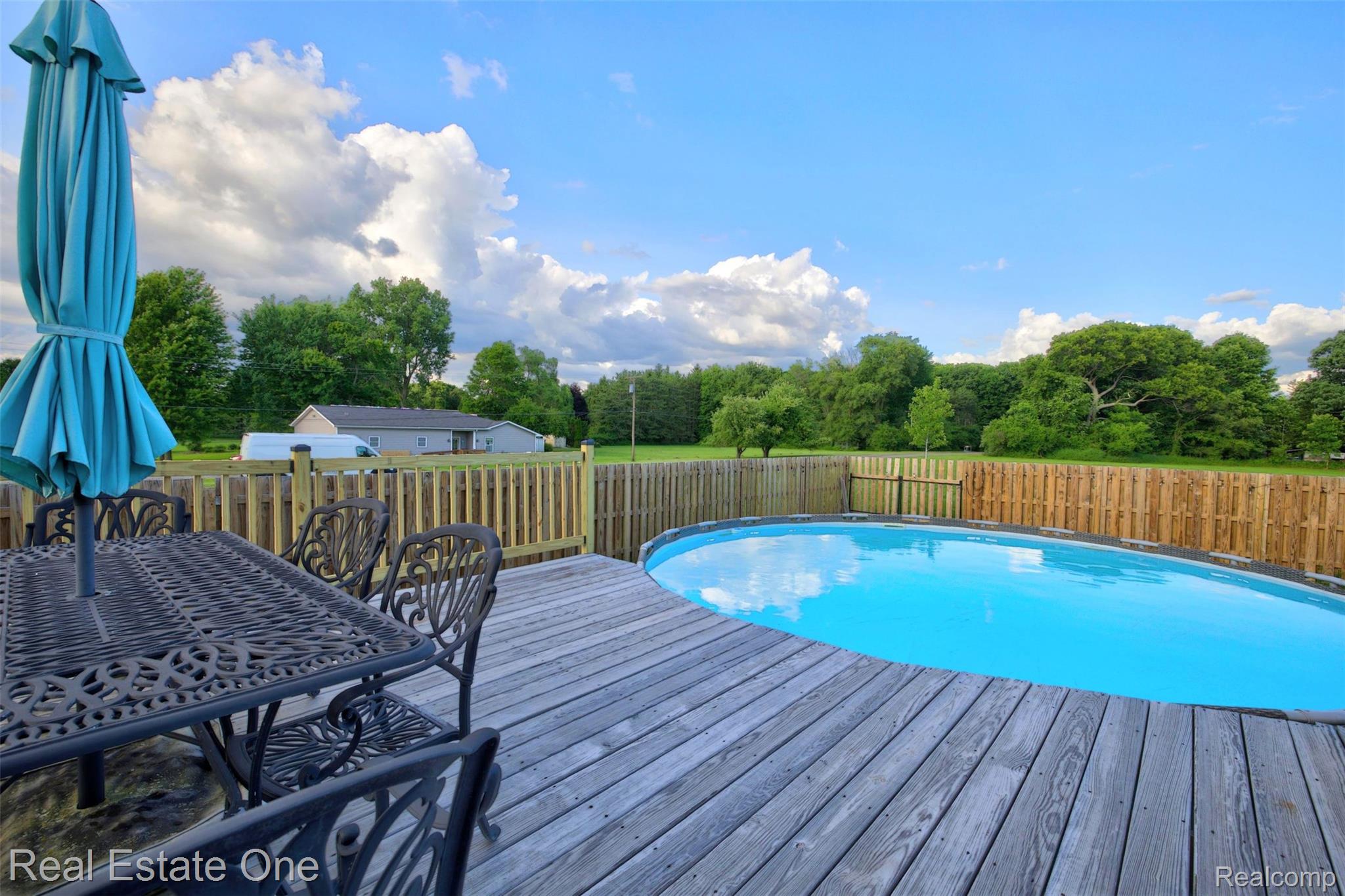 2355 South Sashabaw Road Ortonville, MI 48462 - Photo 47 of 57 56) Back Deck and Pool.jpg