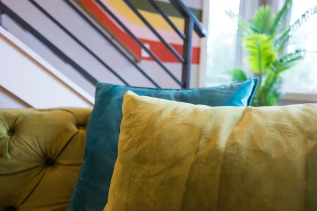 a close view of light fixtures and toilet