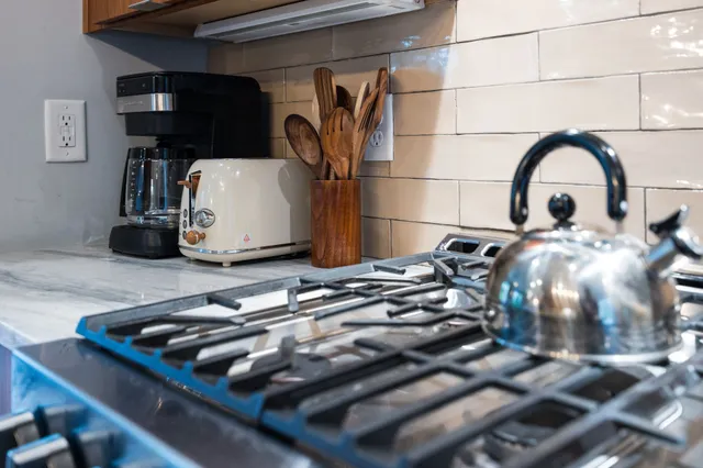 a table with wine bottles and glasses on it