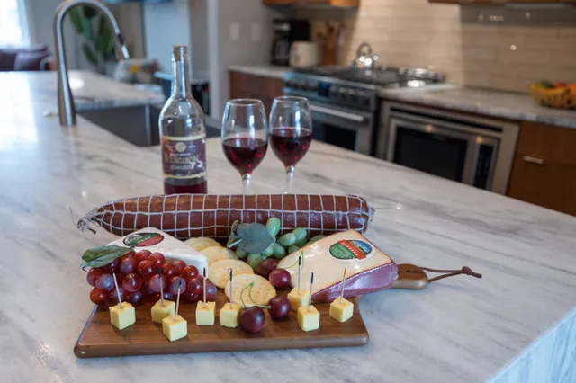 a bedroom with beds and a chandelier