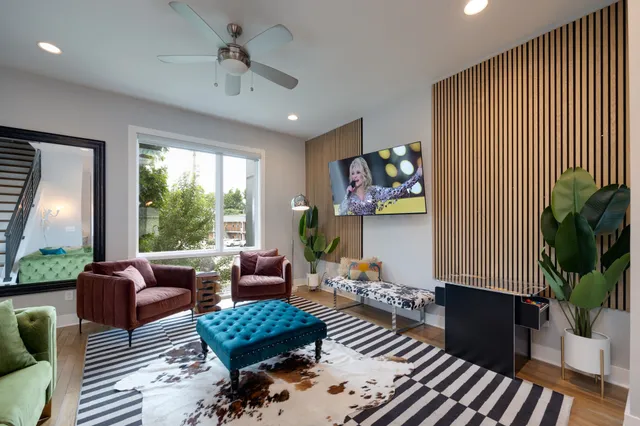 a living room with furniture and a large window
