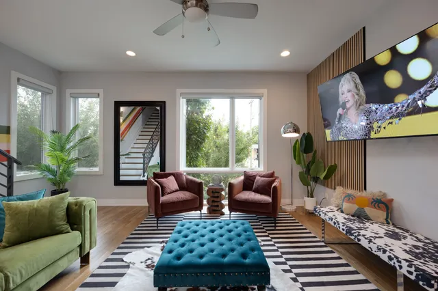 a living room with furniture and a rug