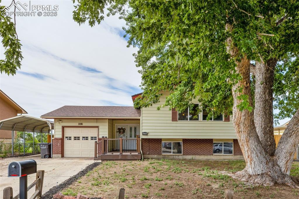 336 Harvard Street Colorado Springs, CO 80911 - Photo 1 of 27 a front view of a house with garden
