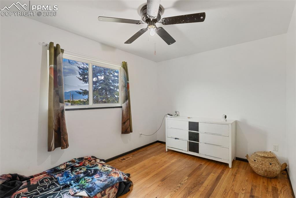 336 Harvard Street Colorado Springs, CO 80911 - Photo 12 of 27 a room with furniture and a window