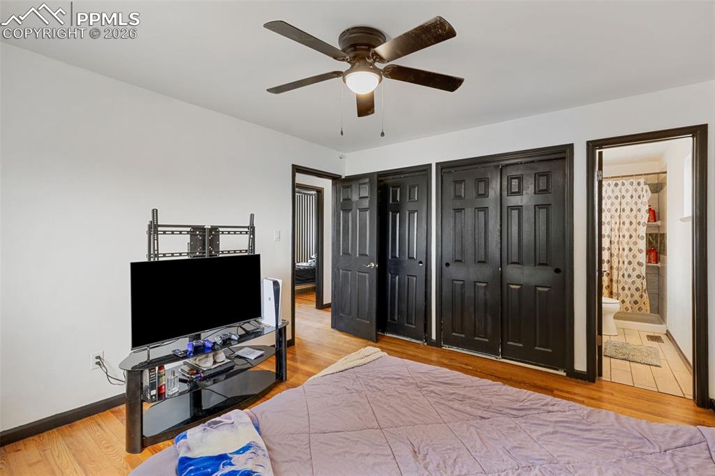 336 Harvard Street Colorado Springs, CO 80911 - Photo 13 of 27 a bedroom with furniture and flat screen tv