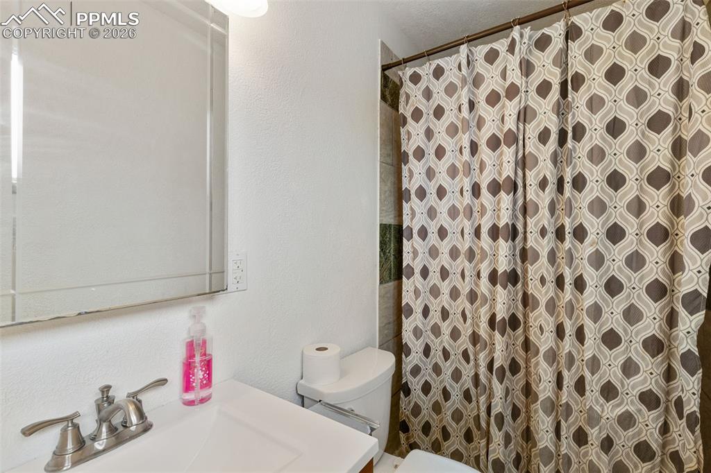 336 Harvard Street Colorado Springs, CO 80911 - Photo 15 of 27 a bathroom with a sink and a toilet