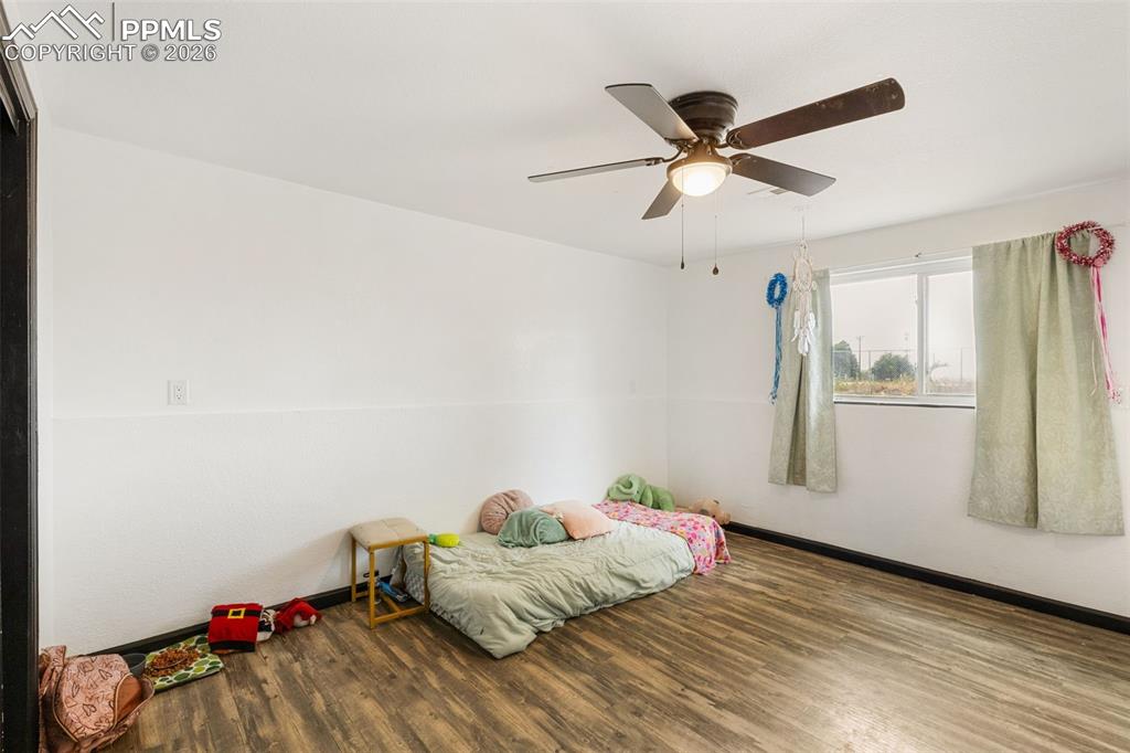 336 Harvard Street Colorado Springs, CO 80911 - Photo 16 of 27 a bedroom with a bed and a window