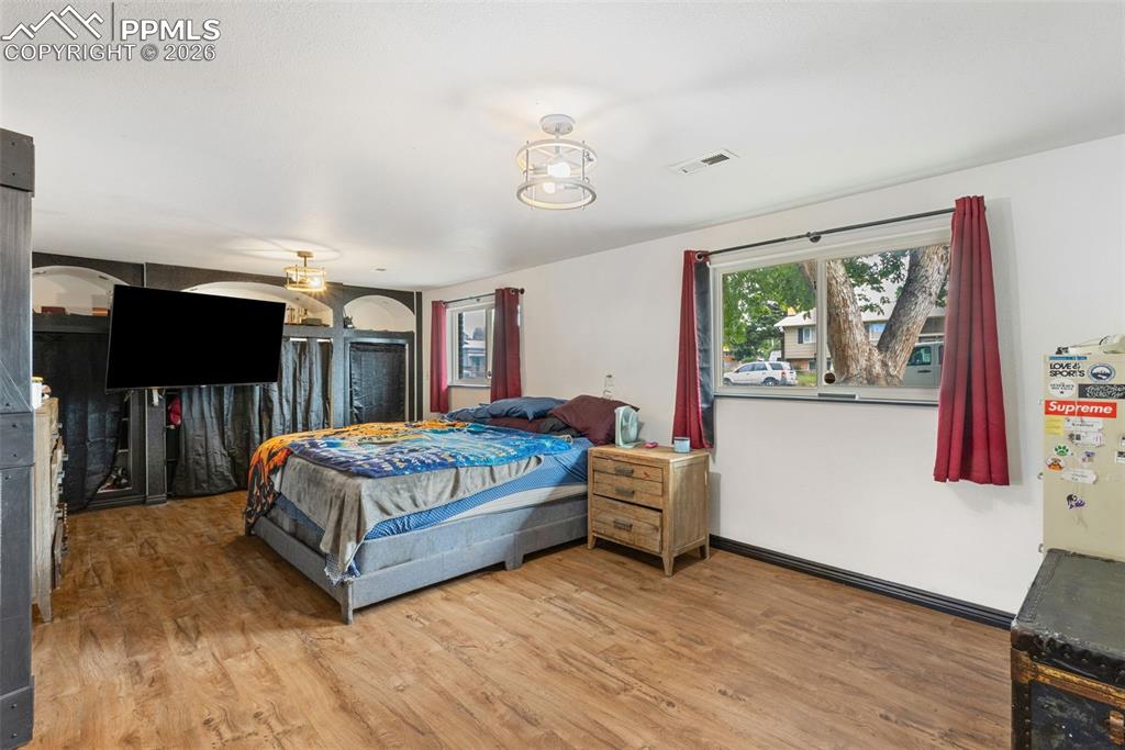 336 Harvard Street Colorado Springs, CO 80911 - Photo 19 of 27 a bedroom with a bed and window