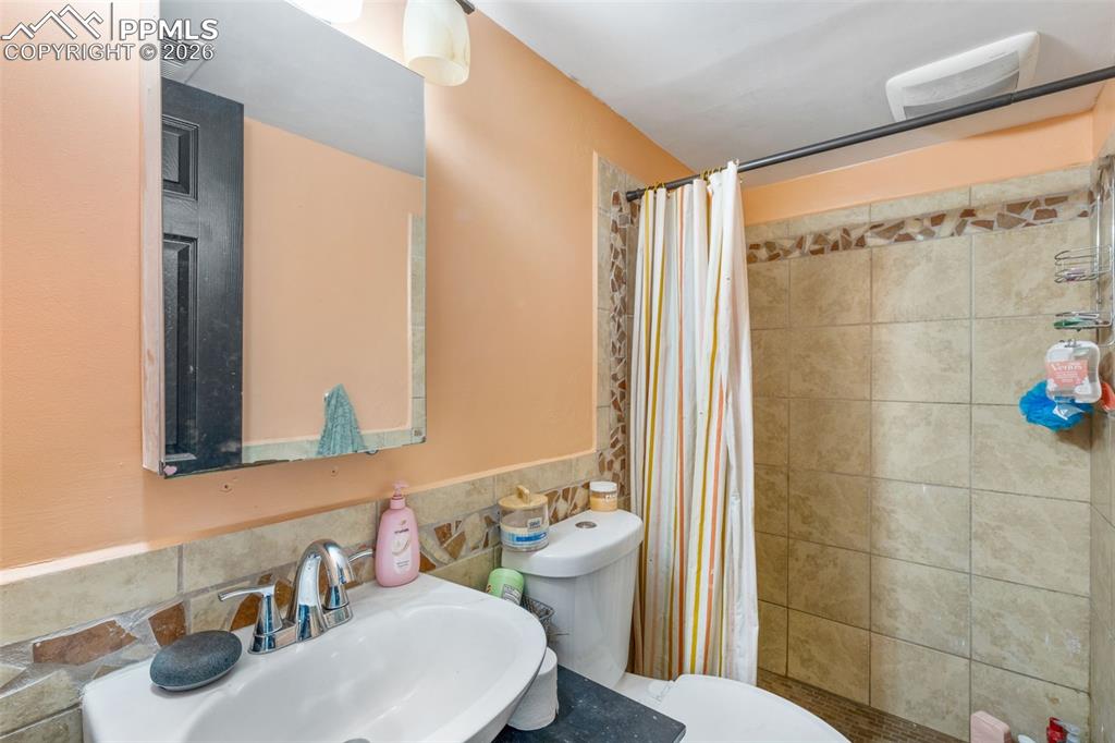 336 Harvard Street Colorado Springs, CO 80911 - Photo 21 of 27 a bathroom with a sink and a mirror