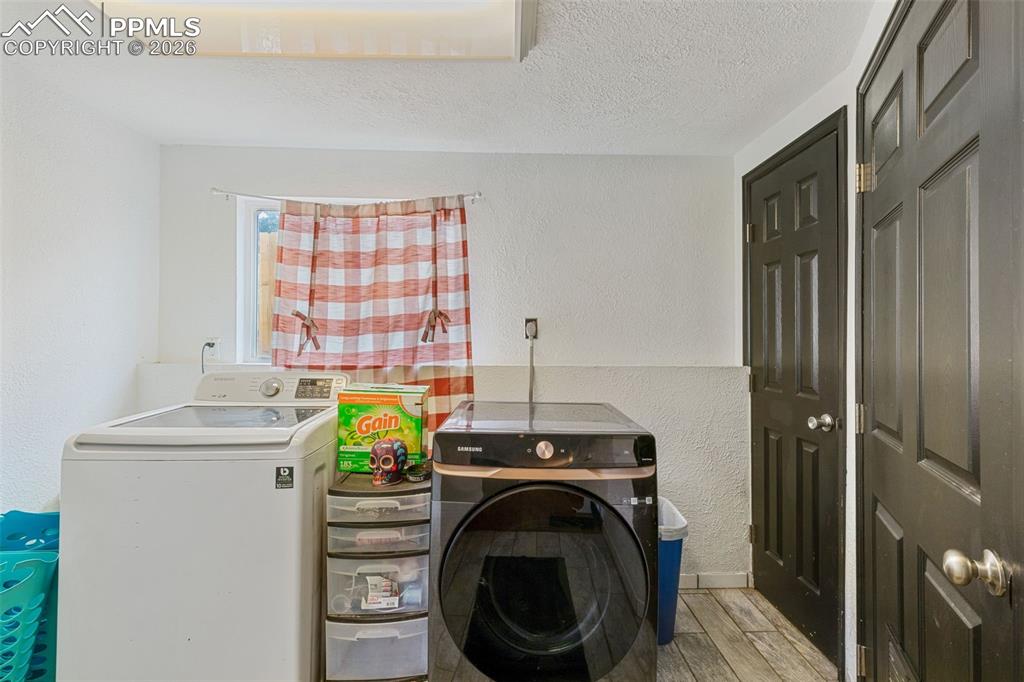 336 Harvard Street Colorado Springs, CO 80911 - Photo 23 of 27 a utility room with dryer and washer