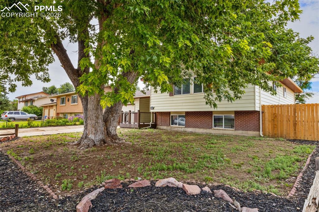 336 Harvard Street Colorado Springs, CO 80911 - Photo 3 of 27 a house that has a tree in front of the house