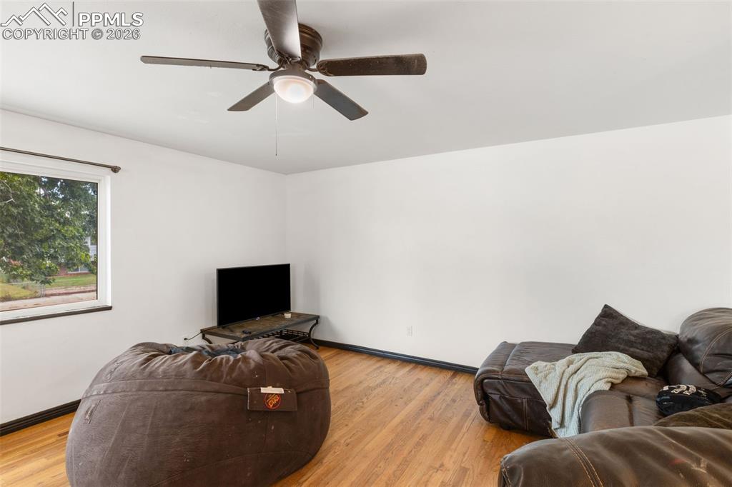 336 Harvard Street Colorado Springs, CO 80911 - Photo 5 of 27 a living room with furniture and a flat screen tv