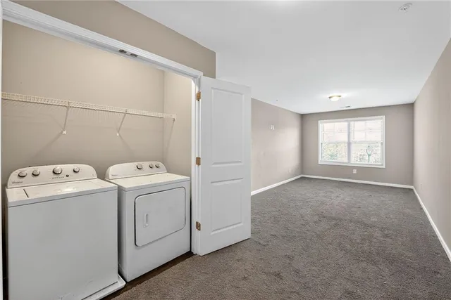 a view of storage and utility room with washer and dryer