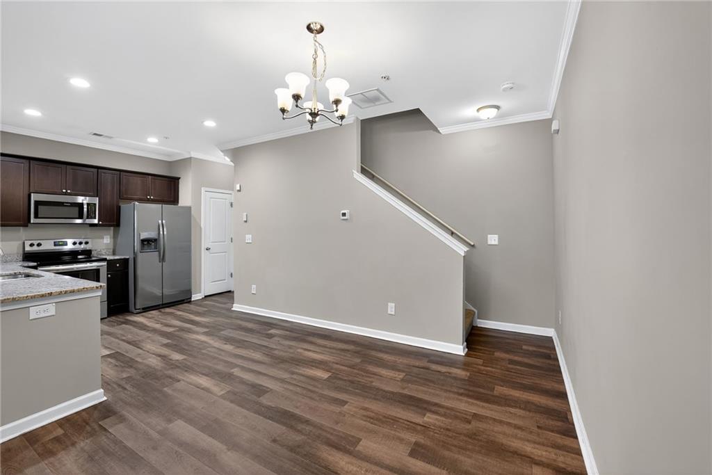 3369 Hidden Stream Court Stockbridge, GA 30281 - Photo 6 of 22 a view of a kitchen with microwave and refrigerator