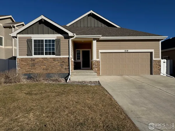 a front view of a house with garage