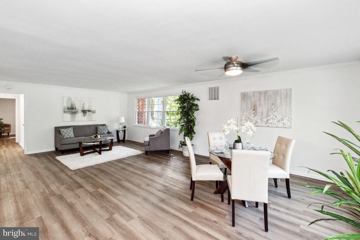 228 Falcon Drive Pasadena, MD 21122 - Photo 11 of 51 DINING AREA WILL HOLE A TABLE FOR 10