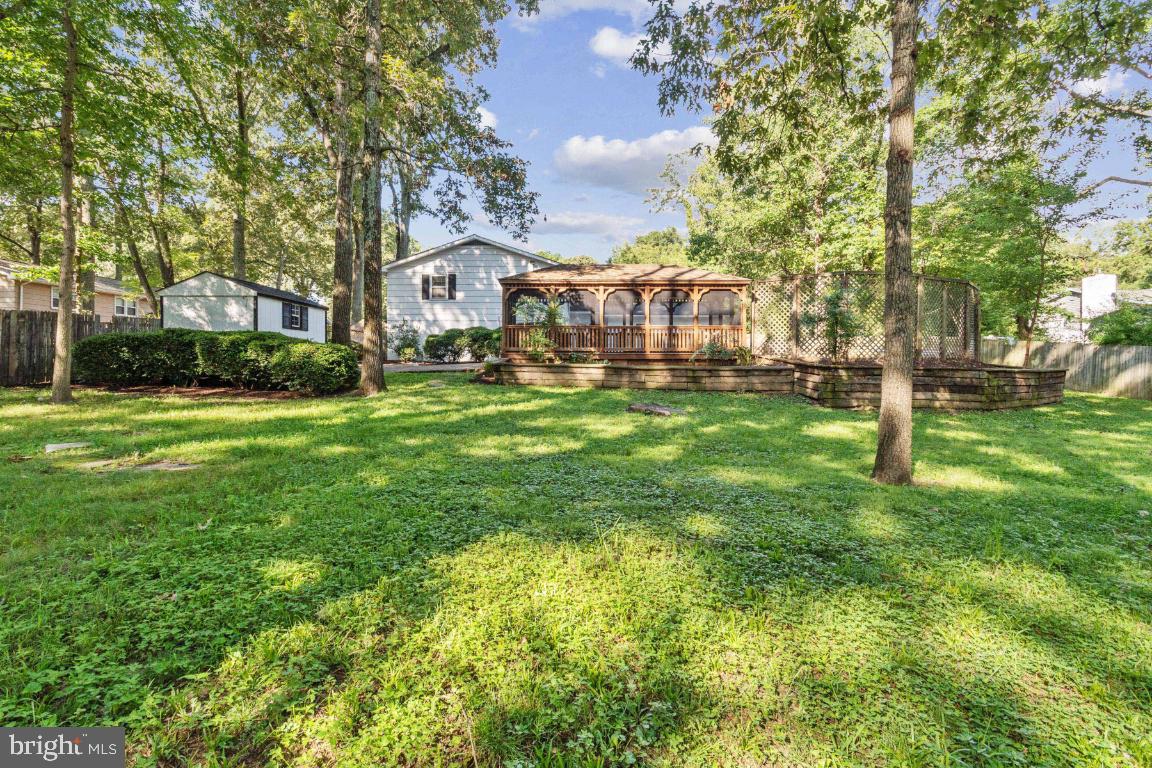 228 Falcon Drive Pasadena, MD 21122 - Photo 43 of 51 BACKYARD VIEW TO THE HOUSE