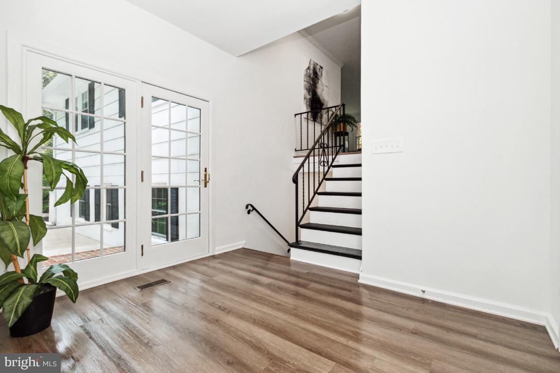 228 Falcon Drive Pasadena, MD 21122 - Photo 7 of 51 ENTRANCE FOYER WITH DOORS TO BACKYARD