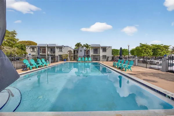 a view of a balcony with two large trees