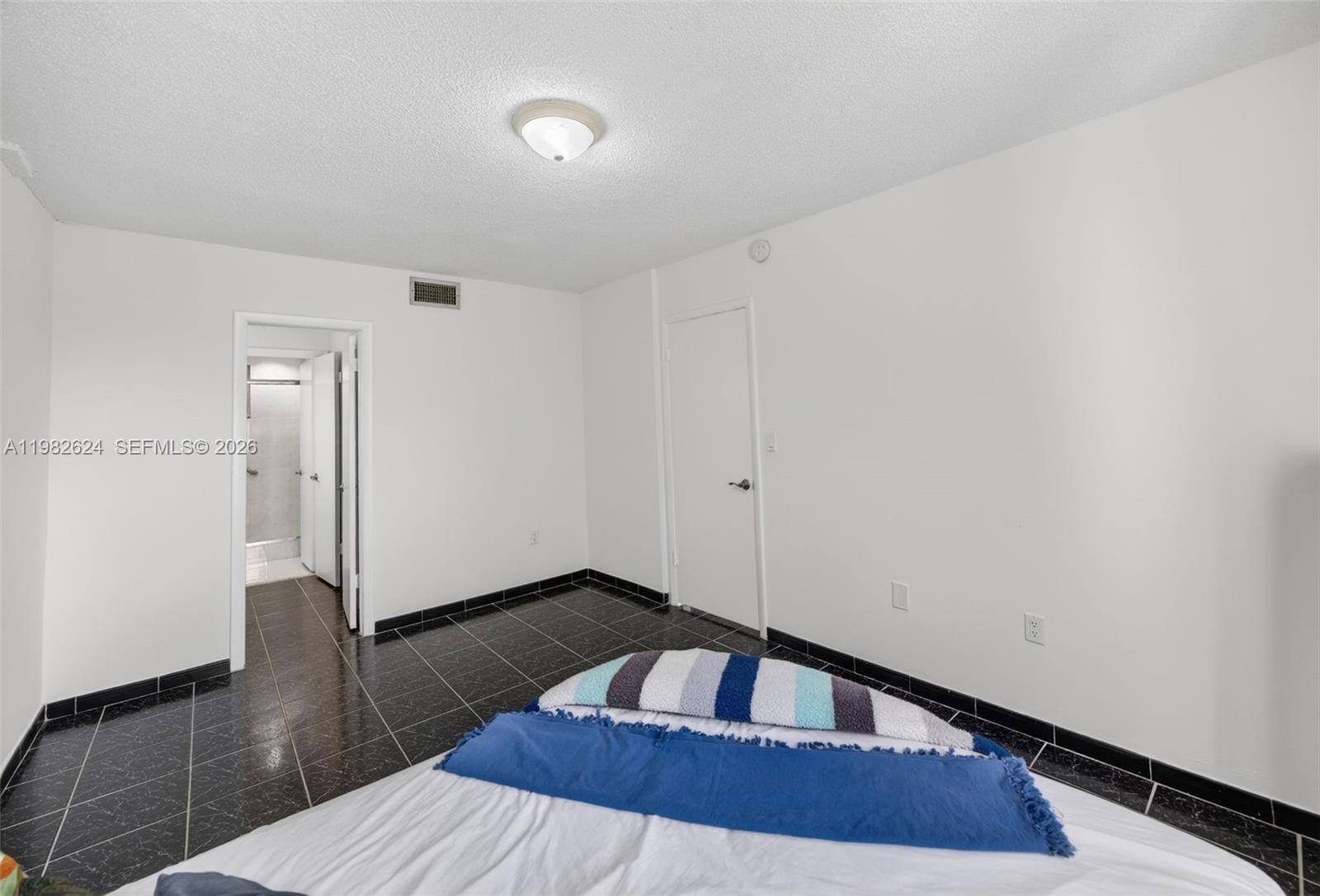 3181 Southwest 13th Street, Unit 416 Miami, FL 33145 - Photo 14 of 40 a view of a livingroom with wooden floor and staircase