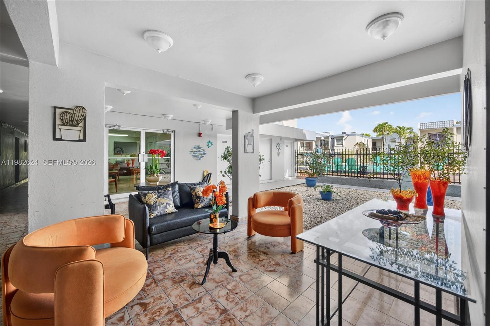 3181 Southwest 13th Street, Unit 416 Miami, FL 33145 - Photo 25 of 40 a living room with furniture a rug and a large window