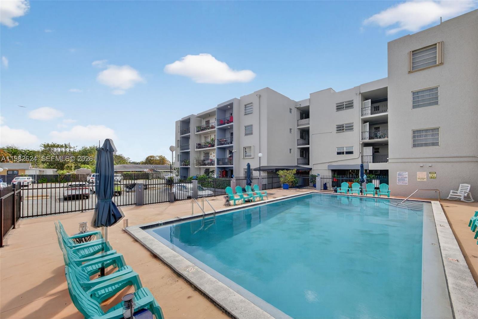 3181 Southwest 13th Street, Unit 416 Miami, FL 33145 - Photo 29 of 40 a view of a swimming pool with a lounge chair