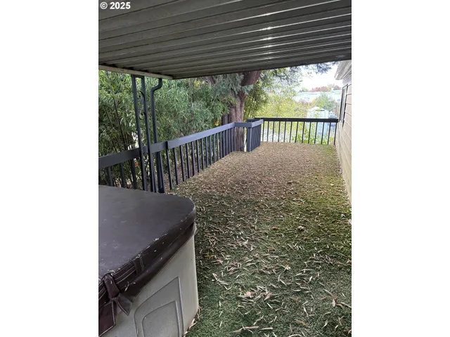 a view of a house with a tree in a yard