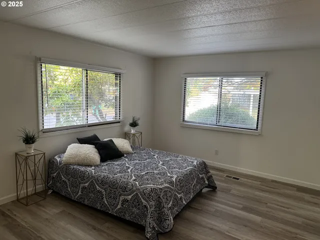 a bedroom with bed and window