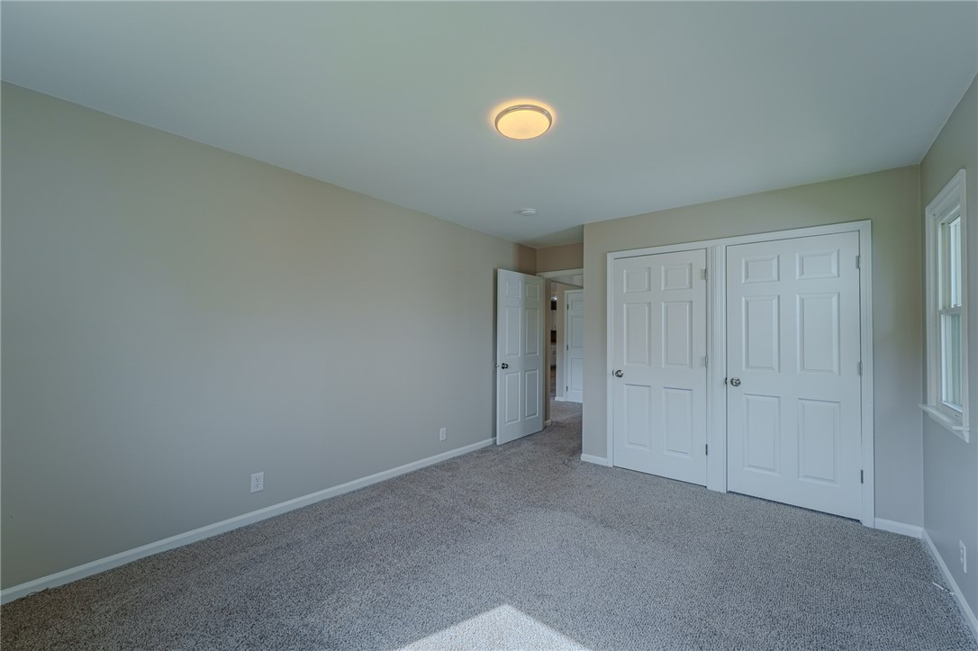 1005 Burt Street Springfield, OH 45505 - Photo 23 of 33 This cozy bedroom offers a tranquil retreat with soft carpeting and natural light.