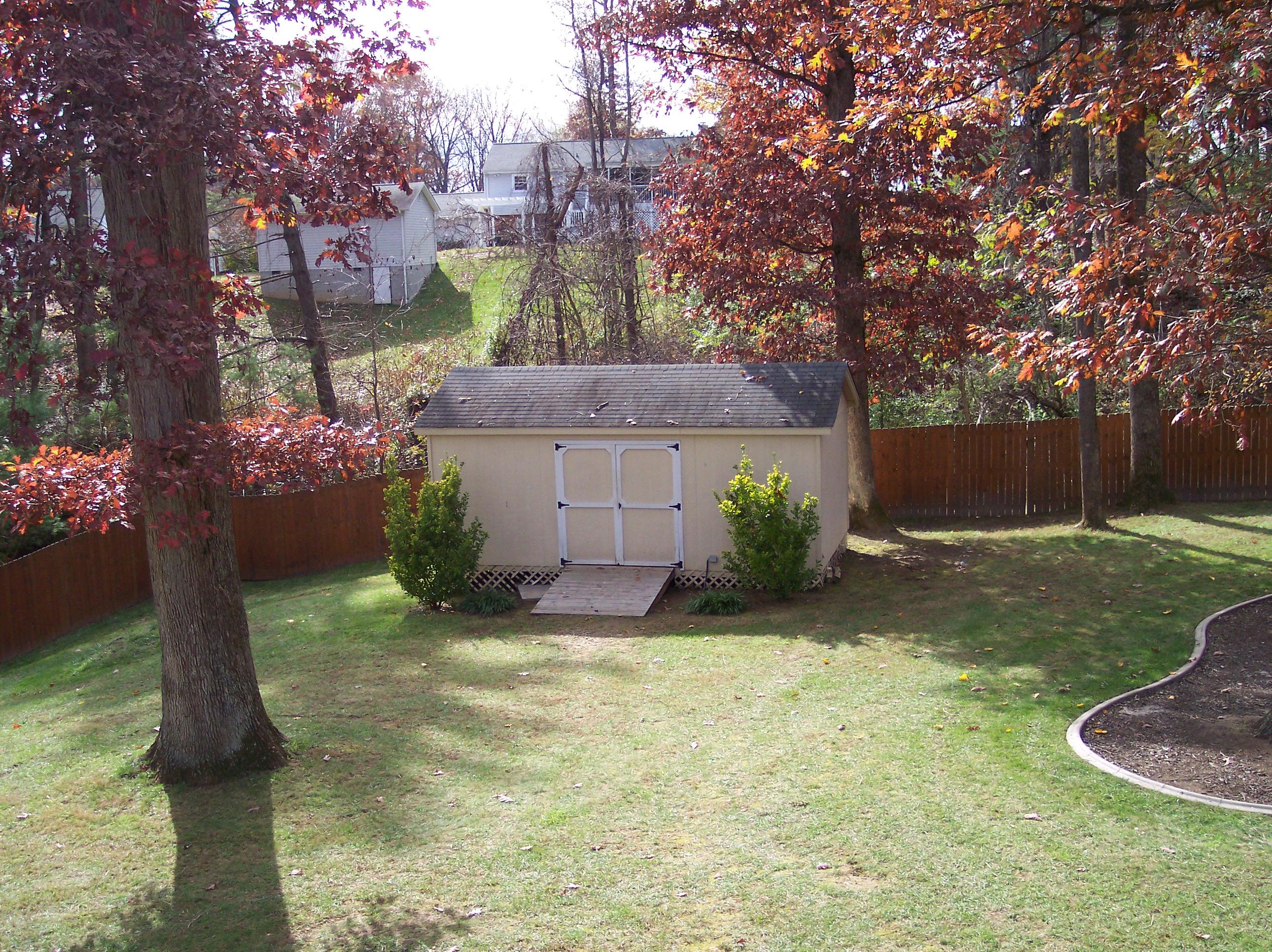 289 Scalybark Drive Blue Ridge, VA 24064 - Photo 72 of 73 a view of a yard in front of a house with large tree