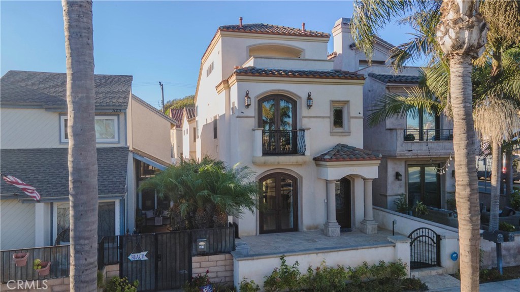 525 15th Street Huntington Beach, CA 92648 - Photo 1 of 46 a view of building with glass windows and entryway