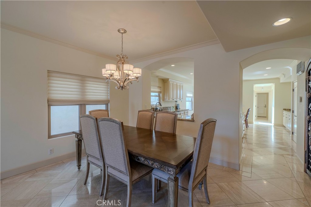 525 15th Street Huntington Beach, CA 92648 - Photo 11 of 46 a view of a dining room with furniture and chandelier