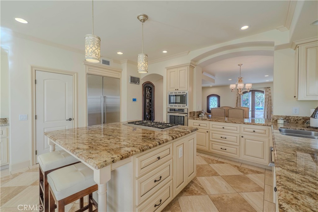 525 15th Street Huntington Beach, CA 92648 - Photo 14 of 46 a bathroom with a granite countertop sink and a mirror