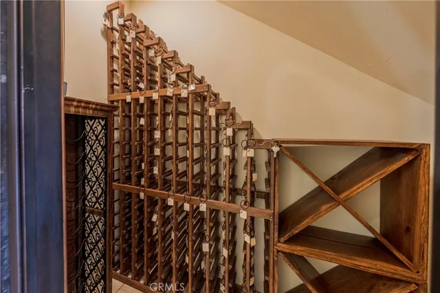a kitchen with white cabinets and a stove
