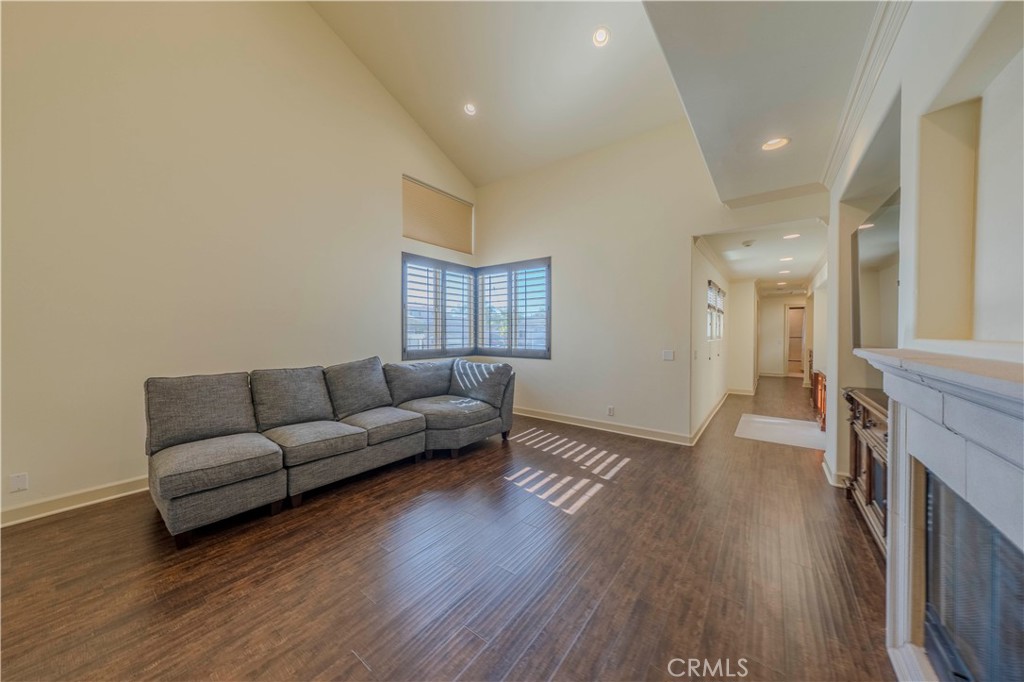 525 15th Street Huntington Beach, CA 92648 - Photo 24 of 46 a living room with furniture and a fireplace