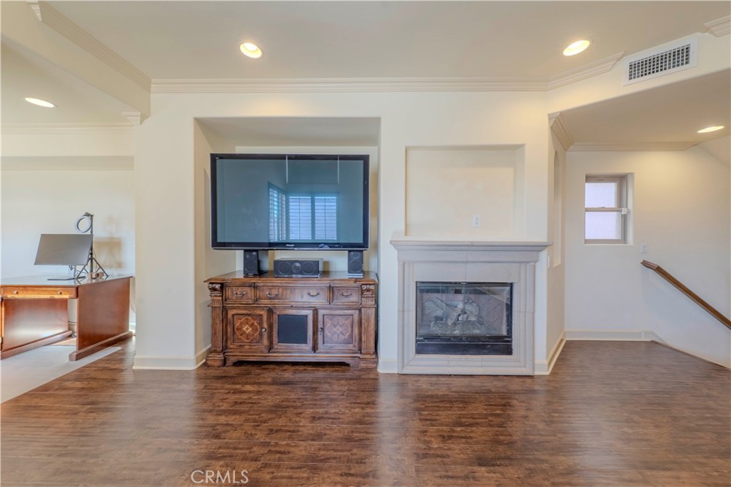 525 15th Street Huntington Beach, CA 92648 - Photo 25 of 46 a living room with furniture and a fireplace