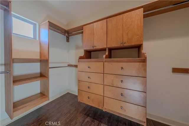 a kitchen with a refrigerator and cabinets