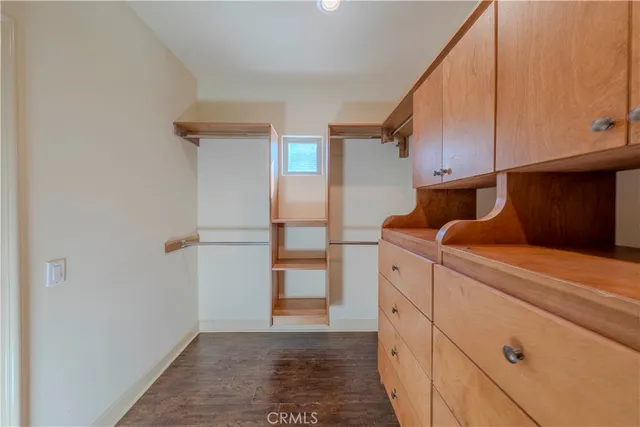 a spacious bathroom with a granite countertop sink mirror and vanity