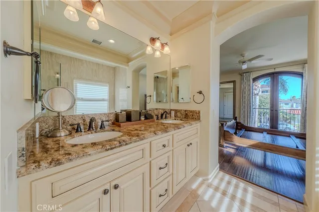 a bathroom with a sink vanity and a mirror