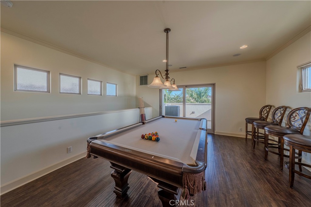 525 15th Street Huntington Beach, CA 92648 - Photo 40 of 46 a view of a dining room with furniture window and wooden floor